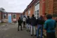 Asylum seekers queue for the one canteen at Napier Barracks 