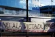 Protesters unveil a banner reading No To the Dictatorship in